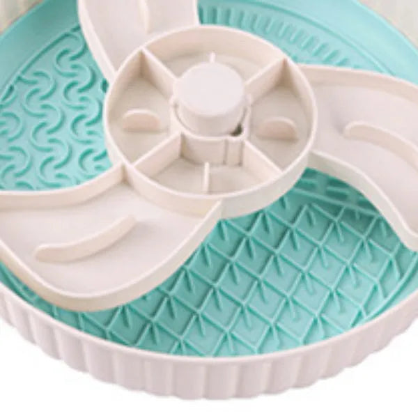 Slow feeder dog bowl with rotating game board and textured silicone licking mat insert.