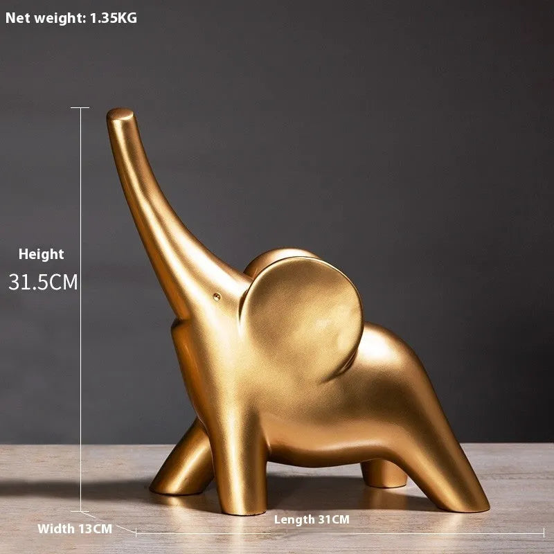 Modern resin elephant ornament in rose gold colour with raised trunk on display surface