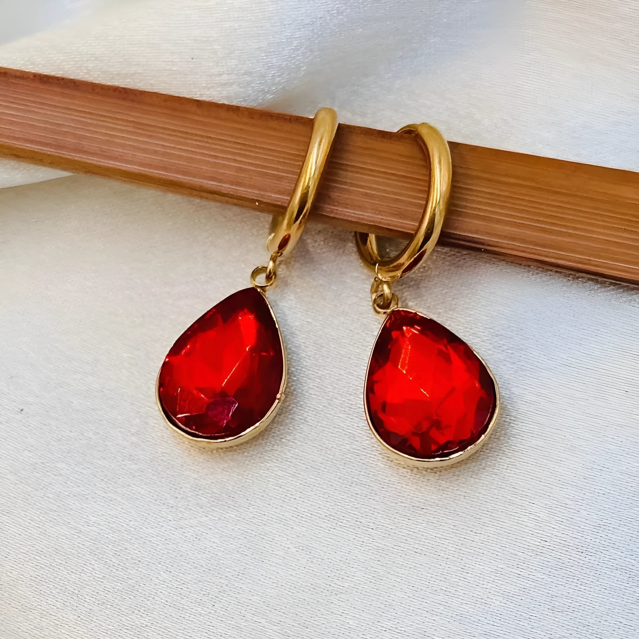 Geometric glass water drop earrings with carved Saturn design in multiple colours