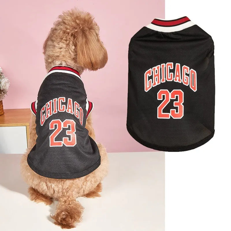 Dog wearing a black mesh polyester basketball vest with number 23 print, side view