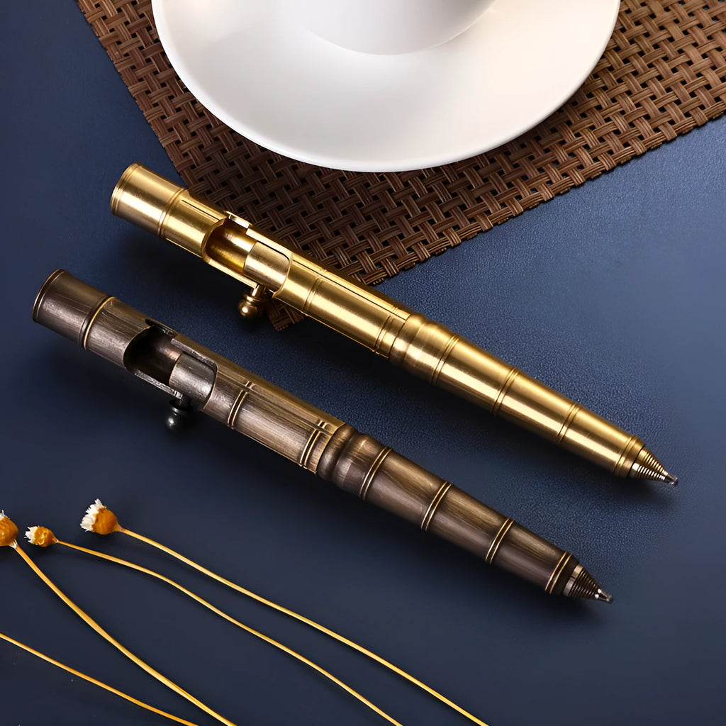 Brass tactical pen with bolt mechanism and six-ring grip pattern