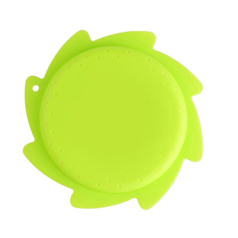 Silicone water toy in blue expression style on a wet surface for bath play