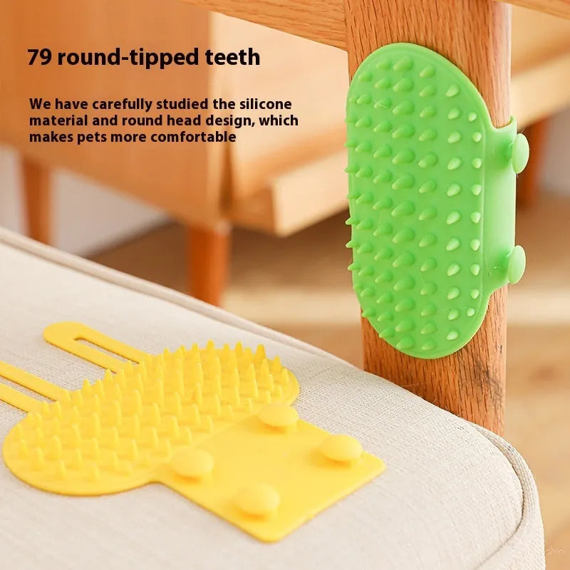 Black silicone cat grooming brush with comb teeth and an adjustable mounting strap.