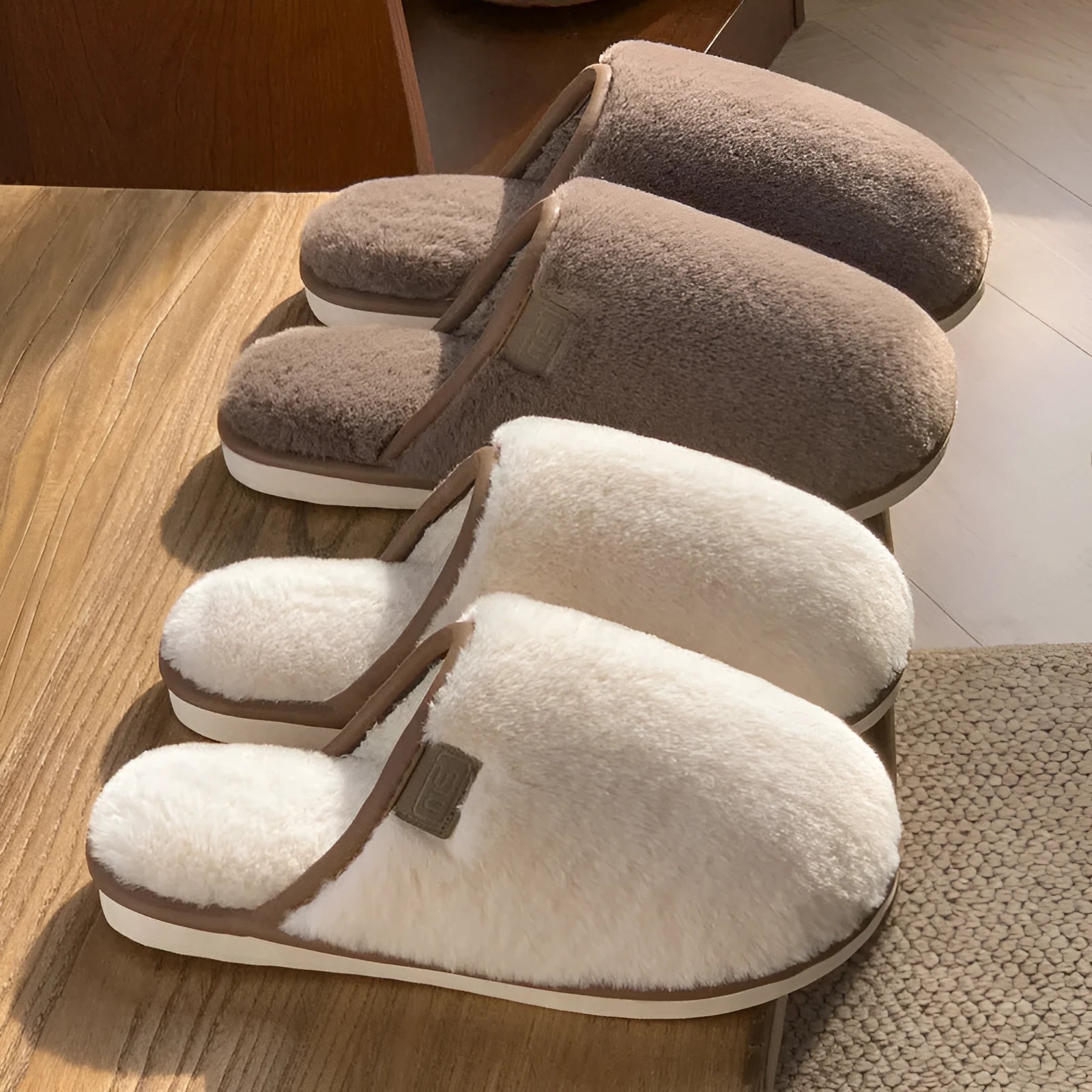 Solid colour winter plush slippers with non-slip PVC soles on a wooden floor