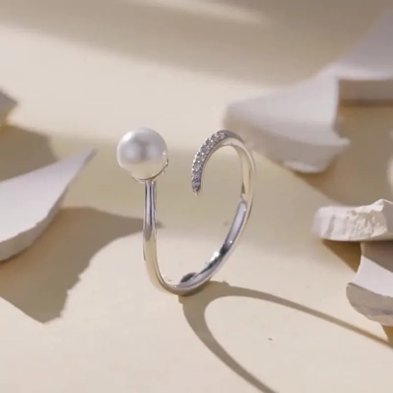 S925 sterling silver adjustable open loop ring with a natural shell pearl.