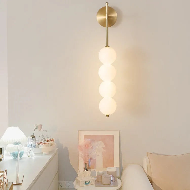Nordic wall lamp in gold finish with tricolour light, rotomoulded construction for bedside atmosphere