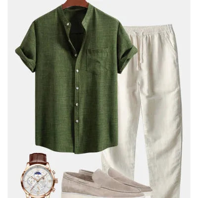 Men's slim-fit short-sleeved shirt with stand collar and digital print, shown with matching pants, shoes, and watch.