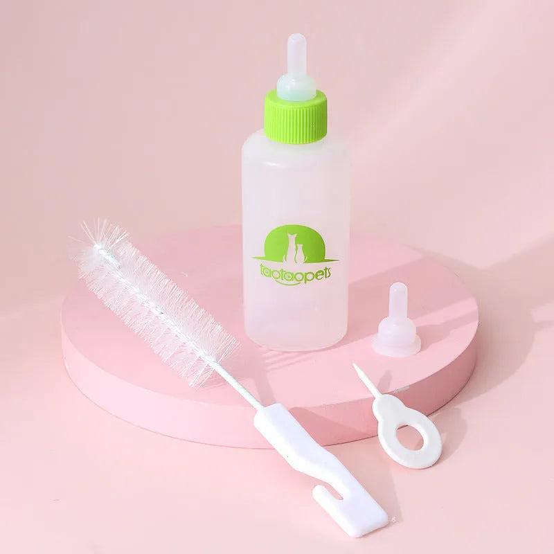 Set of four coloured pet milk bottles and a cleaning brush for feeding small animals
