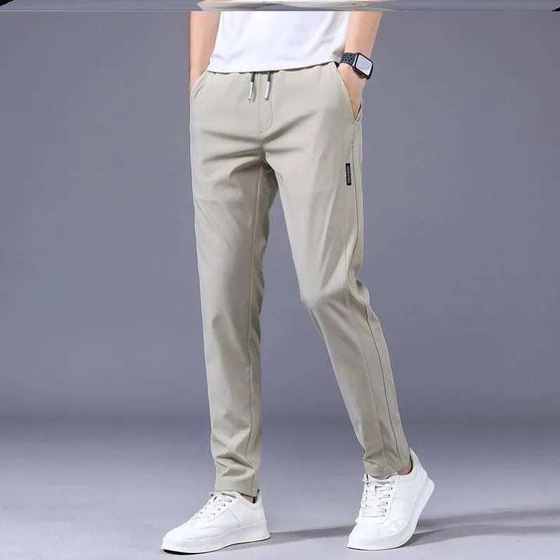 Men's drawstring trousers Korean version loose straight leg sweatpants in khaki colour on model