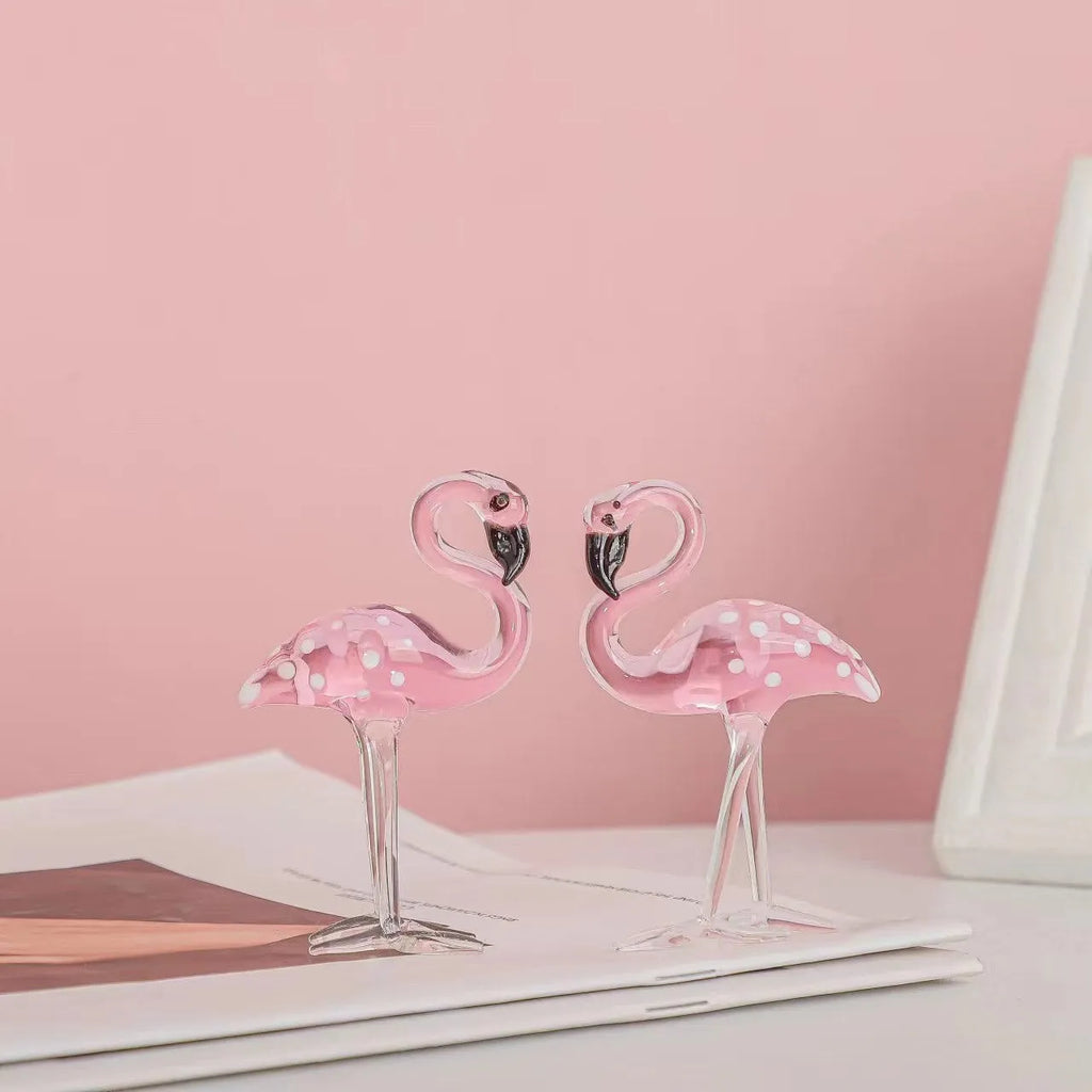 Pink and white crystal flamingo decorative ornament on a table, showing modern simple style.