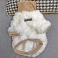 Small dog wearing thick turtleneck winter coat with plush padding in creamy green colour