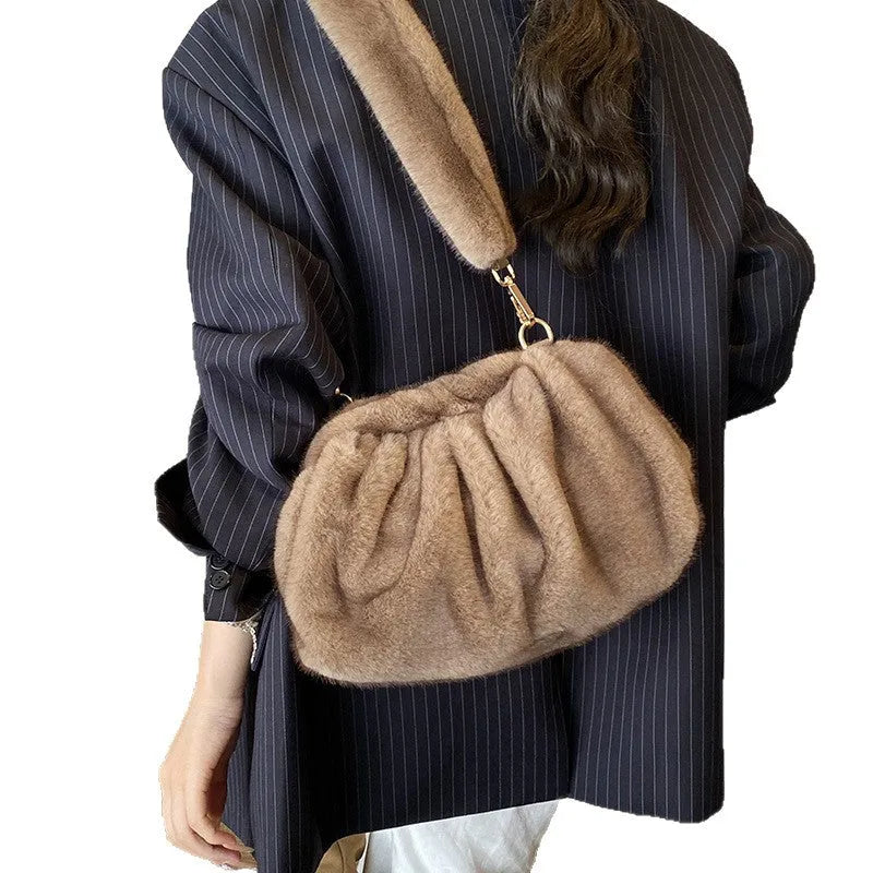 Pleated Cloud women's furry plush bucket handbag in white with stitching detail and shoulder strap