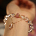 White crystal bracelet with geometric Chinese auspicious patterns and cat eye obsidian detailing