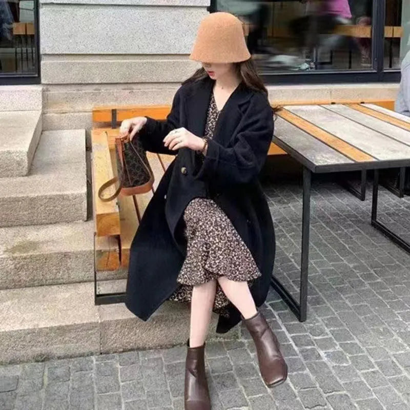 Women's high-grade woolen coat long sleeve in black colour, conventional sleeve design for casual winter wear