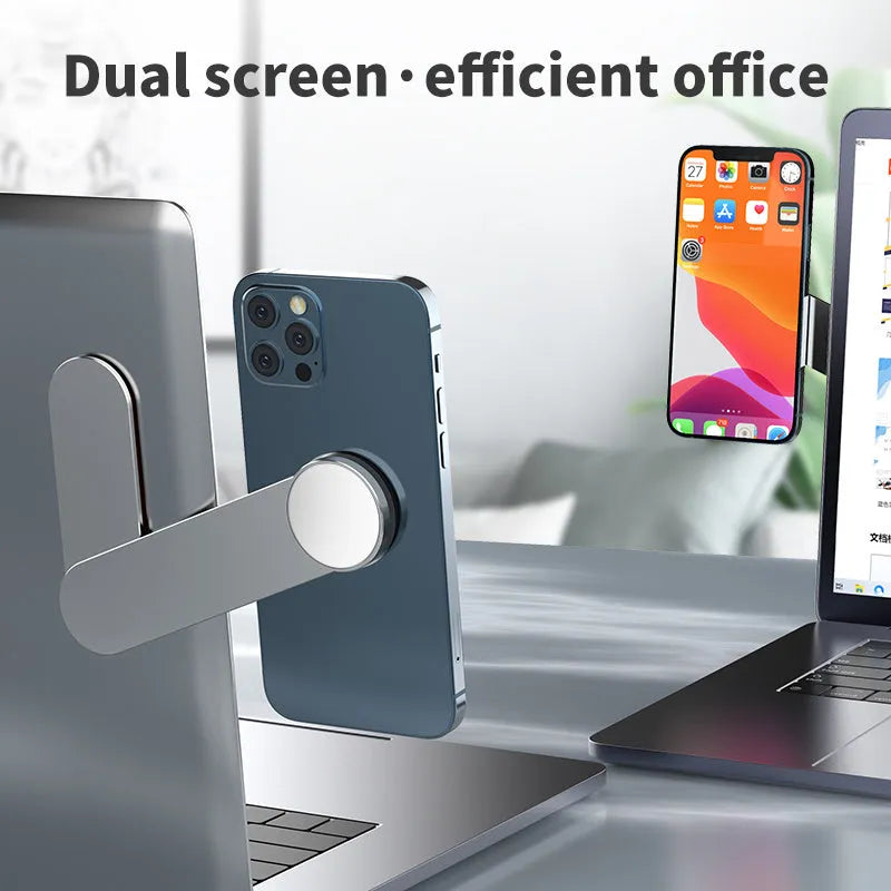Silver aluminium alloy dual screen extension bracket holding mobile phone beside laptop