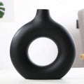 Unglazed porcelain biscuit vase with frosted particle surface in neutral colour