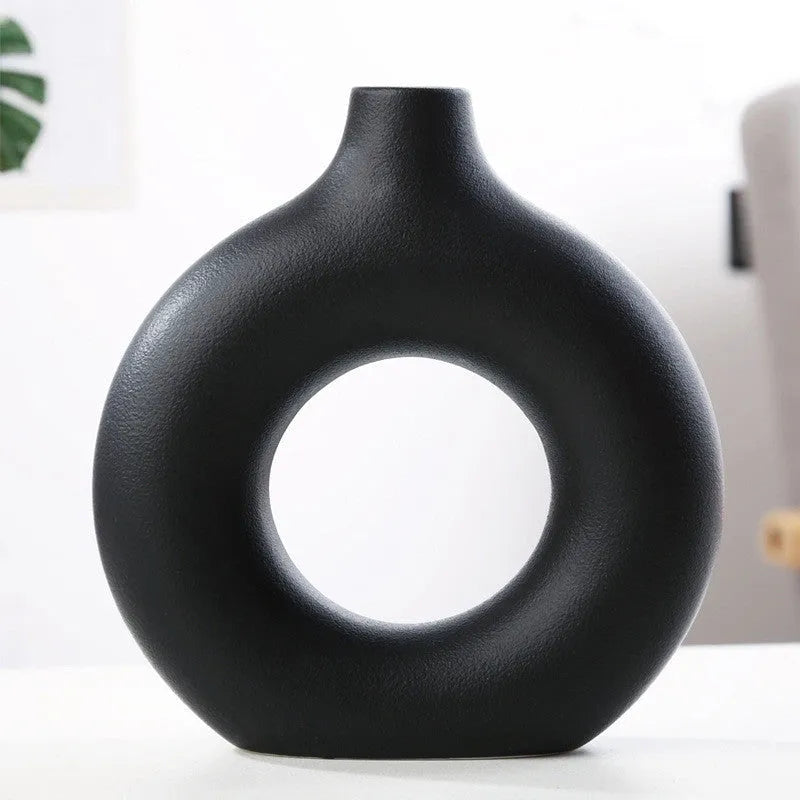 Unglazed porcelain biscuit vase with frosted particle surface in neutral colour