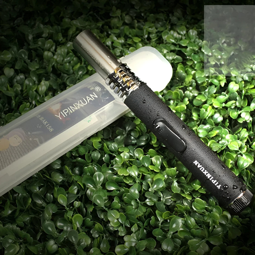 Black portable metal flamethrower torch with child safety lock and gas canister for outdoor use.