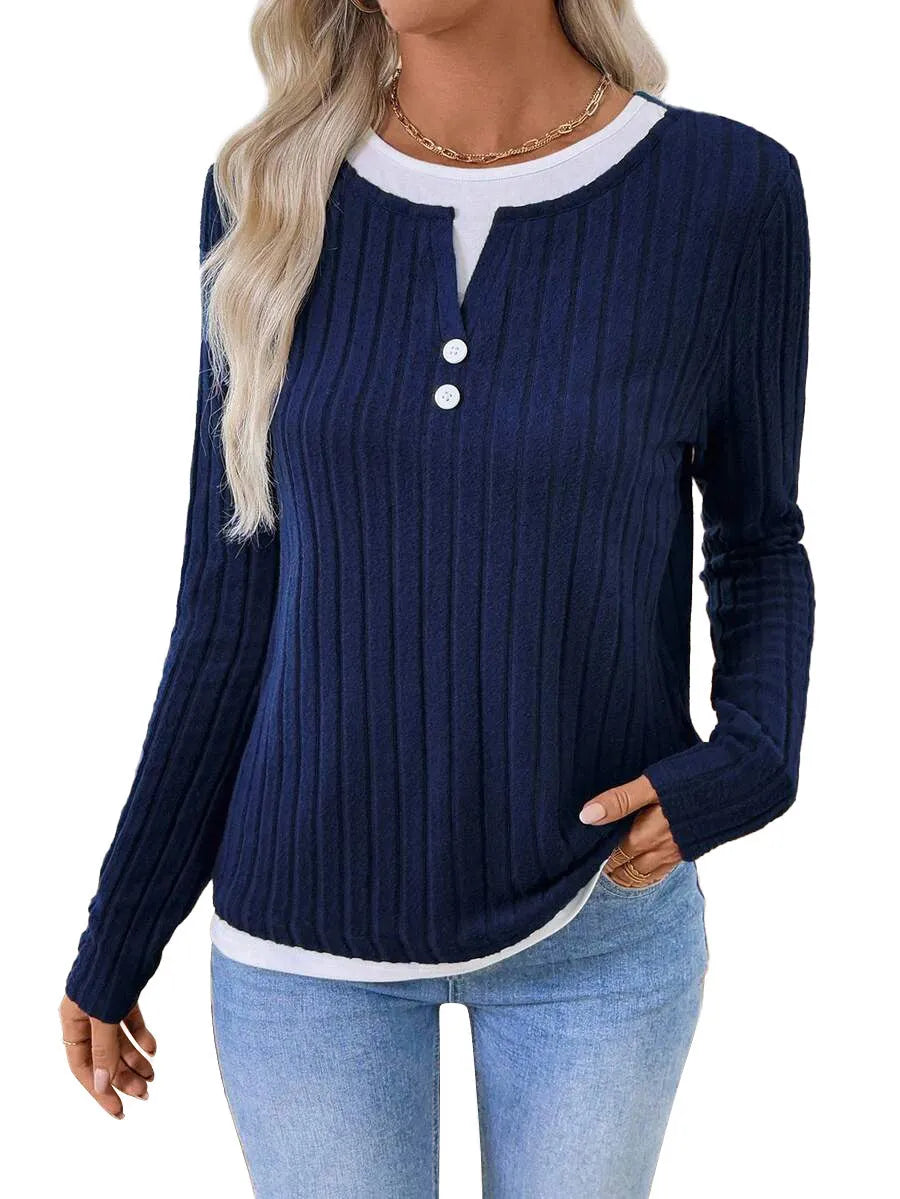 Women's black two-piece style pullover sweater with round neck and button detail on long sleeves.