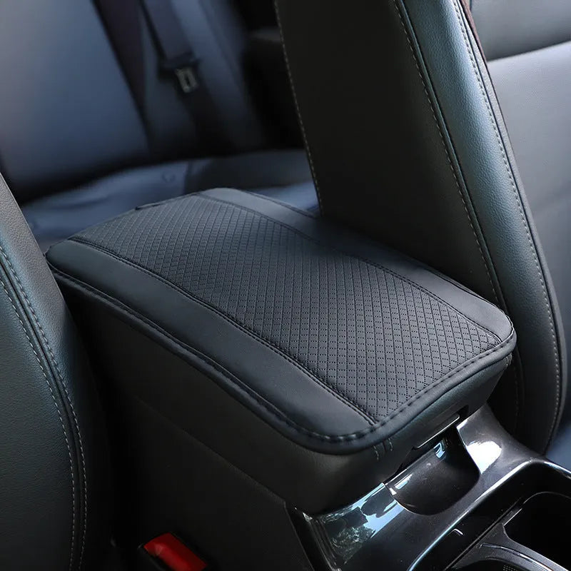 Black embossed PU leather car armrest box cushion mat measuring 32 by 19 centimetres.