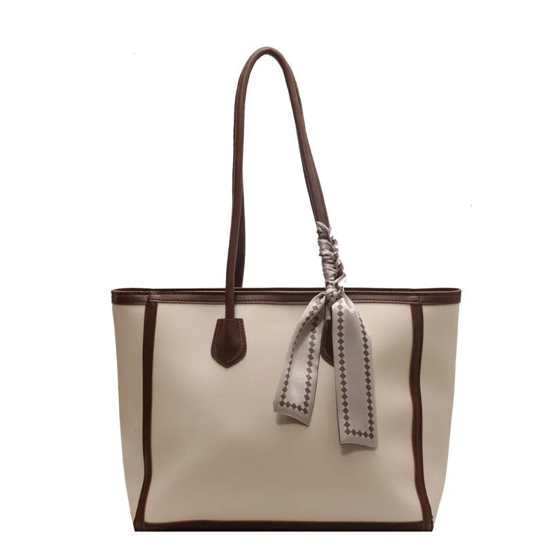 Soft PU commuter shoulder bag showing open pocket, internal phone compartment, and zippered change section