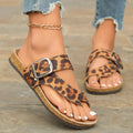 Roman style leopard print slippers with round toe covering and wooden sole