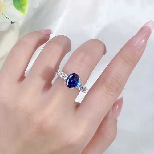 Heart-shaped sterling silver ring with a faceted colour zircon stone on a white background.