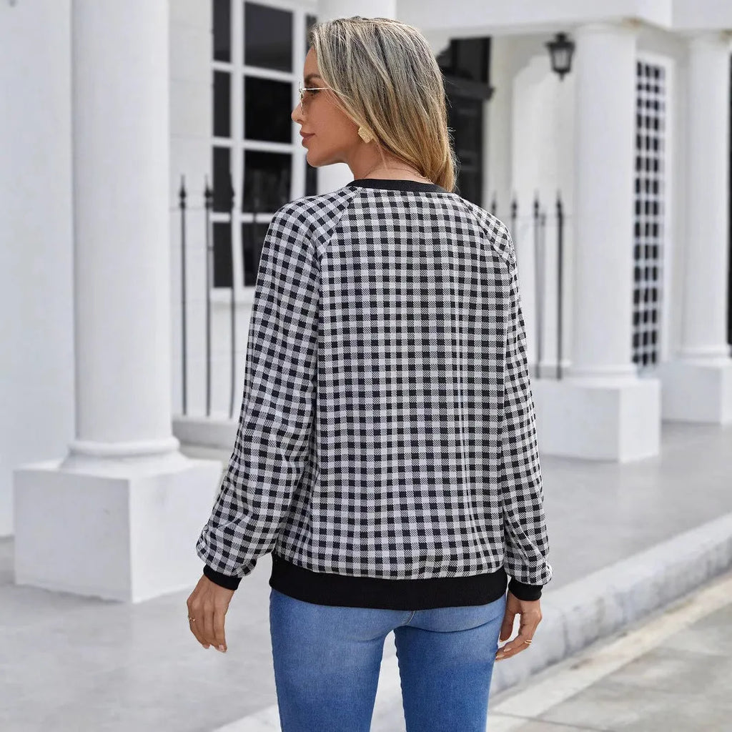 Black long sleeve pullover sweater with plaid and striped printed pattern