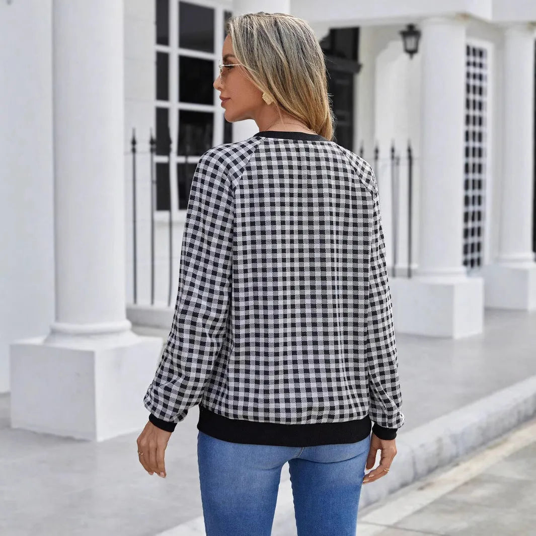 Black long sleeve pullover sweater with plaid and striped printed pattern