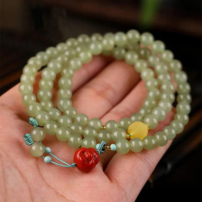 Pale blue Hetian jade bracelet with 6mm beads in three circle pattern