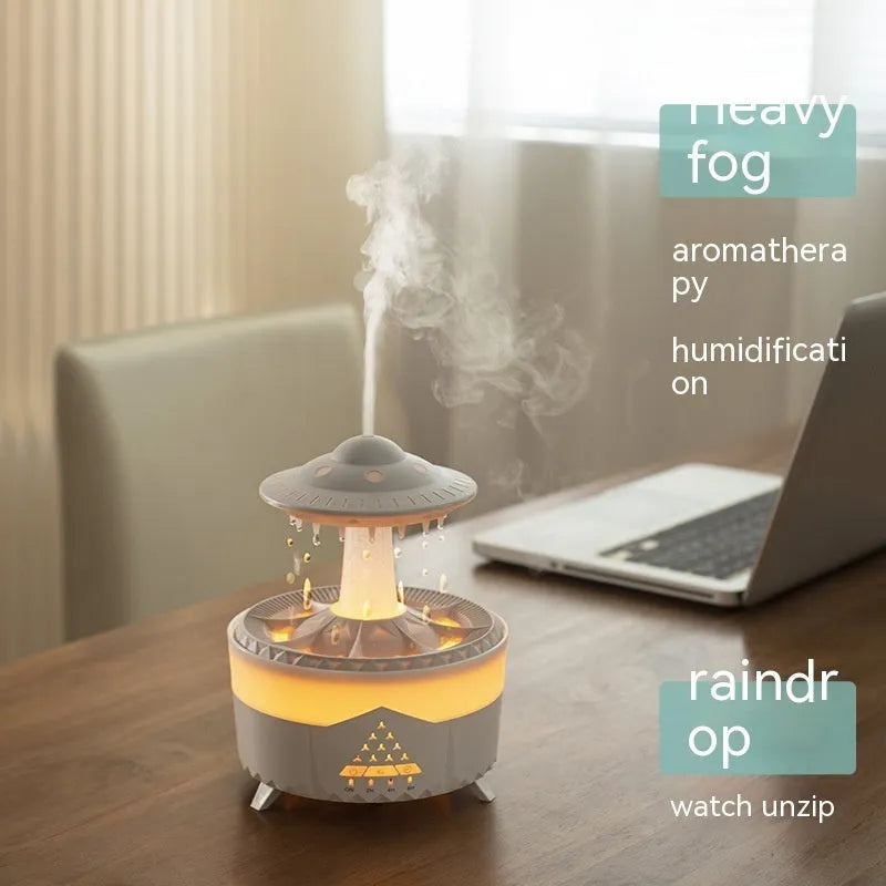 White cloud-shaped UFO raindrop humidifier with water mist and coloured lights