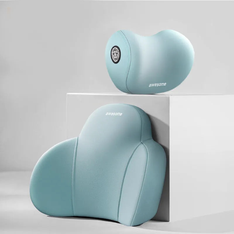 Black and grey memory foam car headrest pillow and lumbar support pillow on a car seat.