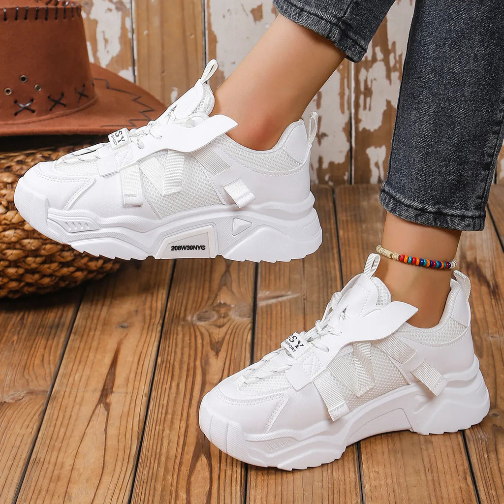 Women's purple platform mesh sports shoe with front lace-up, shown on a white background.