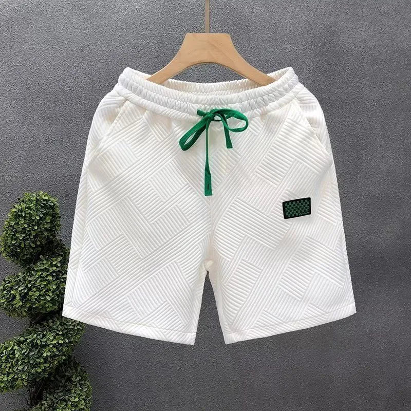 Men's casual sports shorts in polyester fabric showing elastic waistband and solid colour options