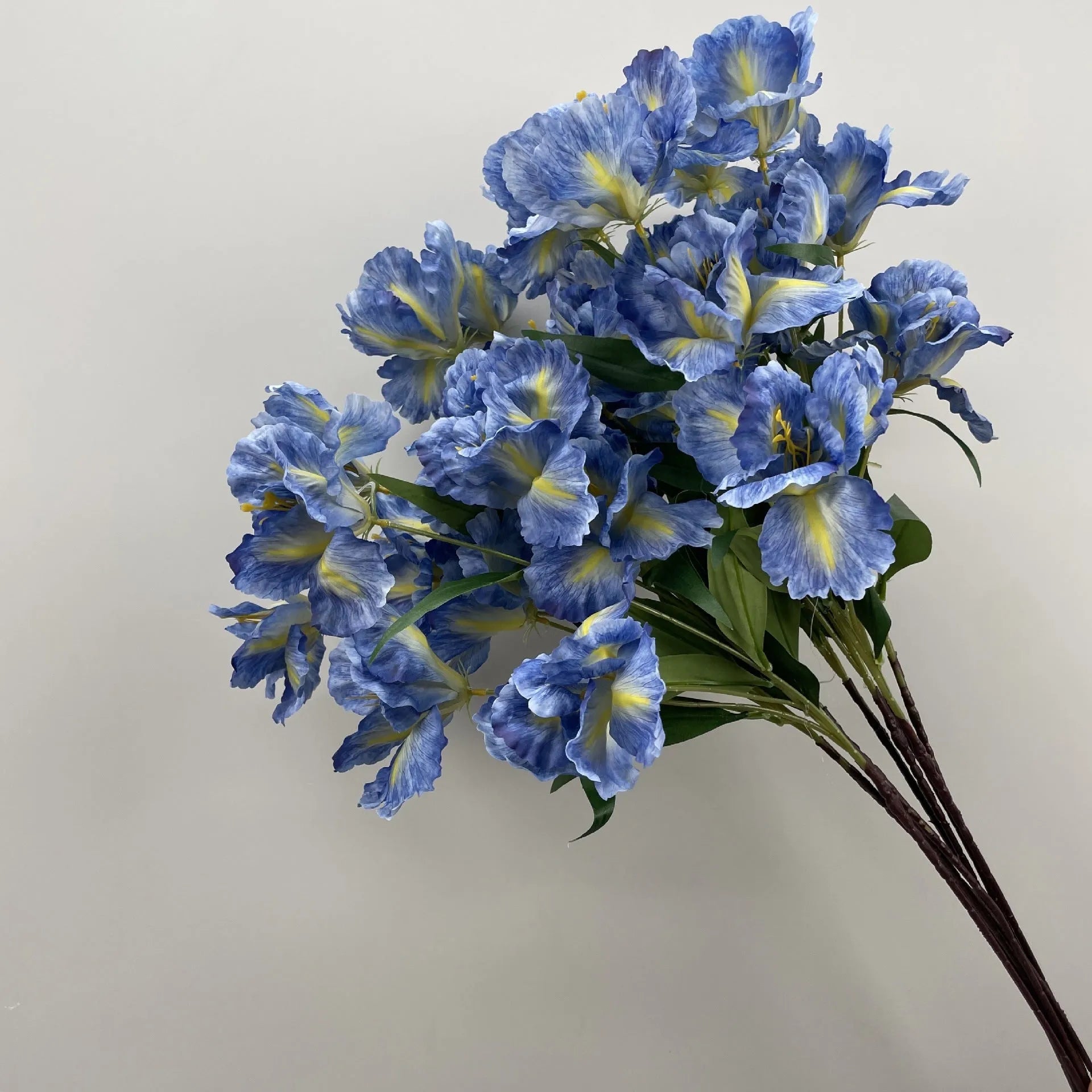 Blue haze artificial silk flower bouquet arranged for decorative display