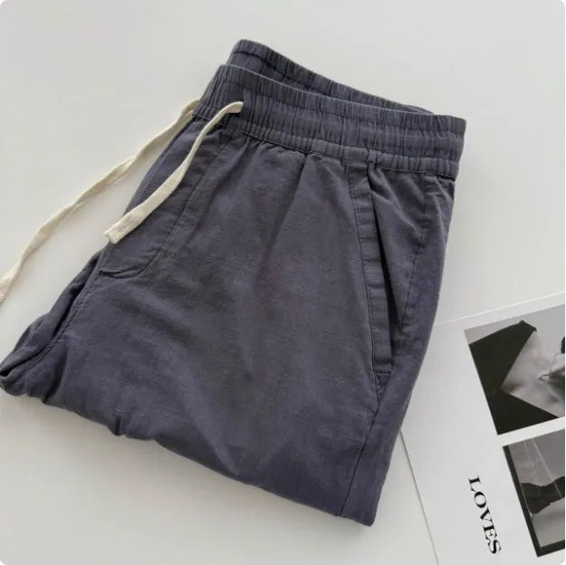 Men's loose straight casual pants in beige colour with drawstring waist detail for summer wear