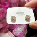 A pair of square geometric women's earrings with a diamond-treated surface in a gold colour option.