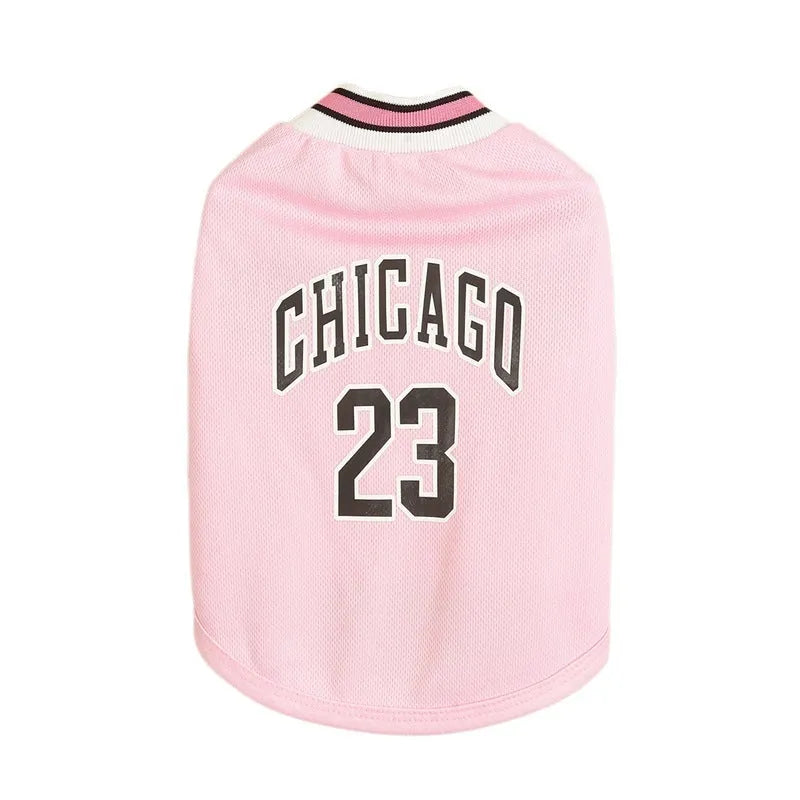 Dog wearing a black mesh polyester basketball vest with number 23 print, side view