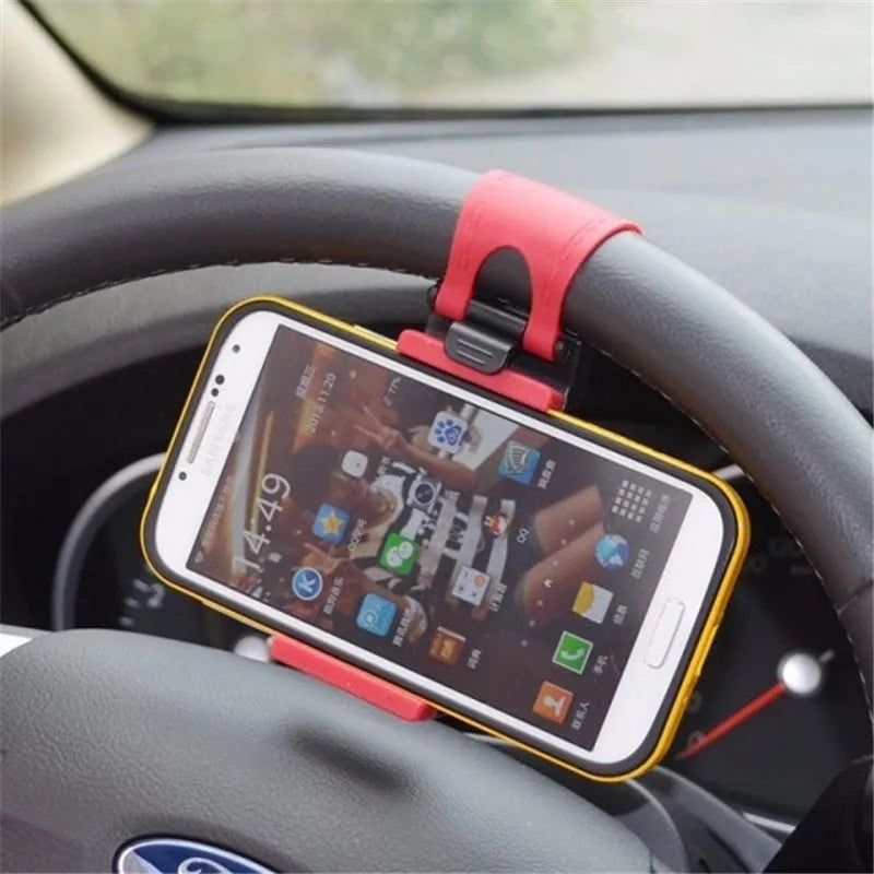 Black universal steering wheel phone clip holder mounted with a smartphone displaying a map.