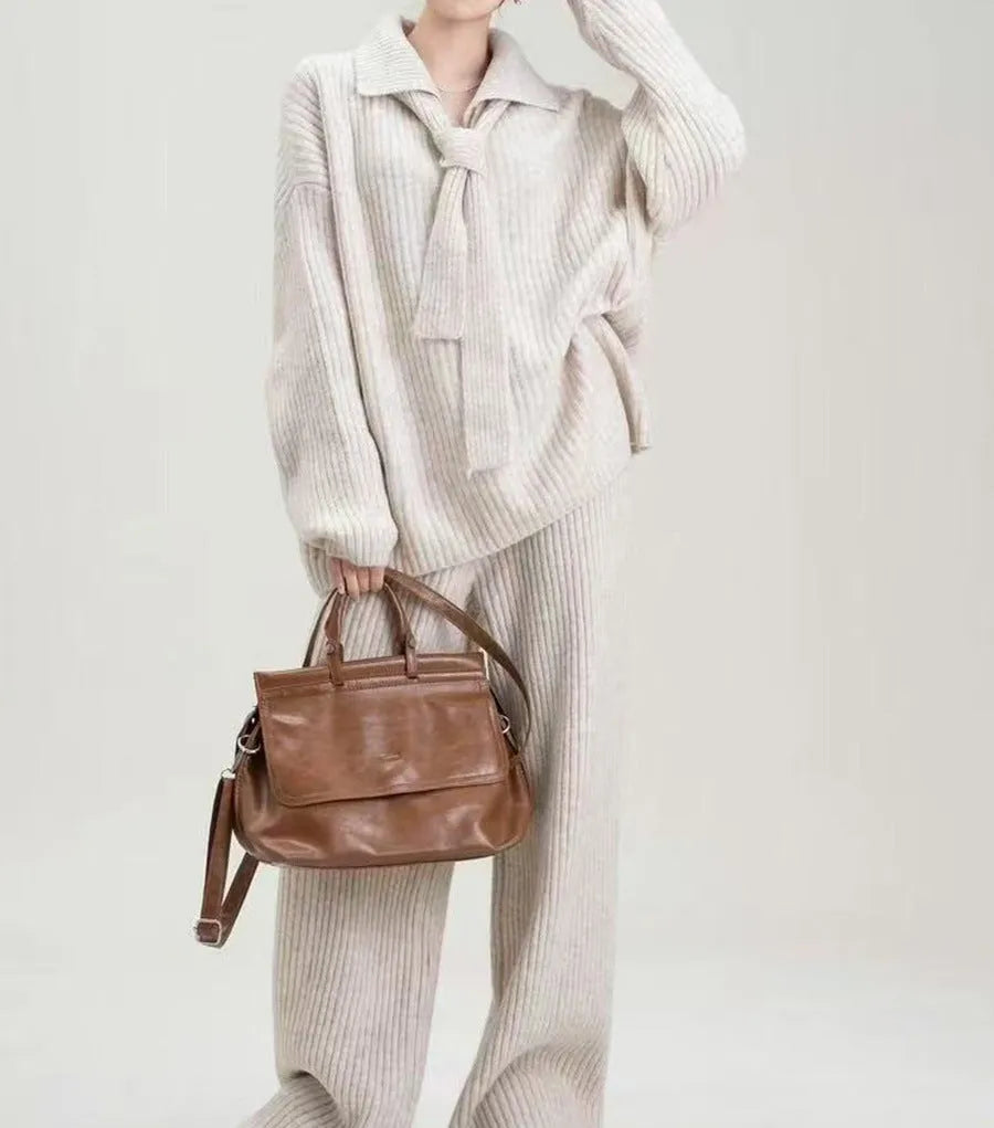 Acrylic fibre sweater suit two-piece set in beige, showing knitted top and casual trousers.