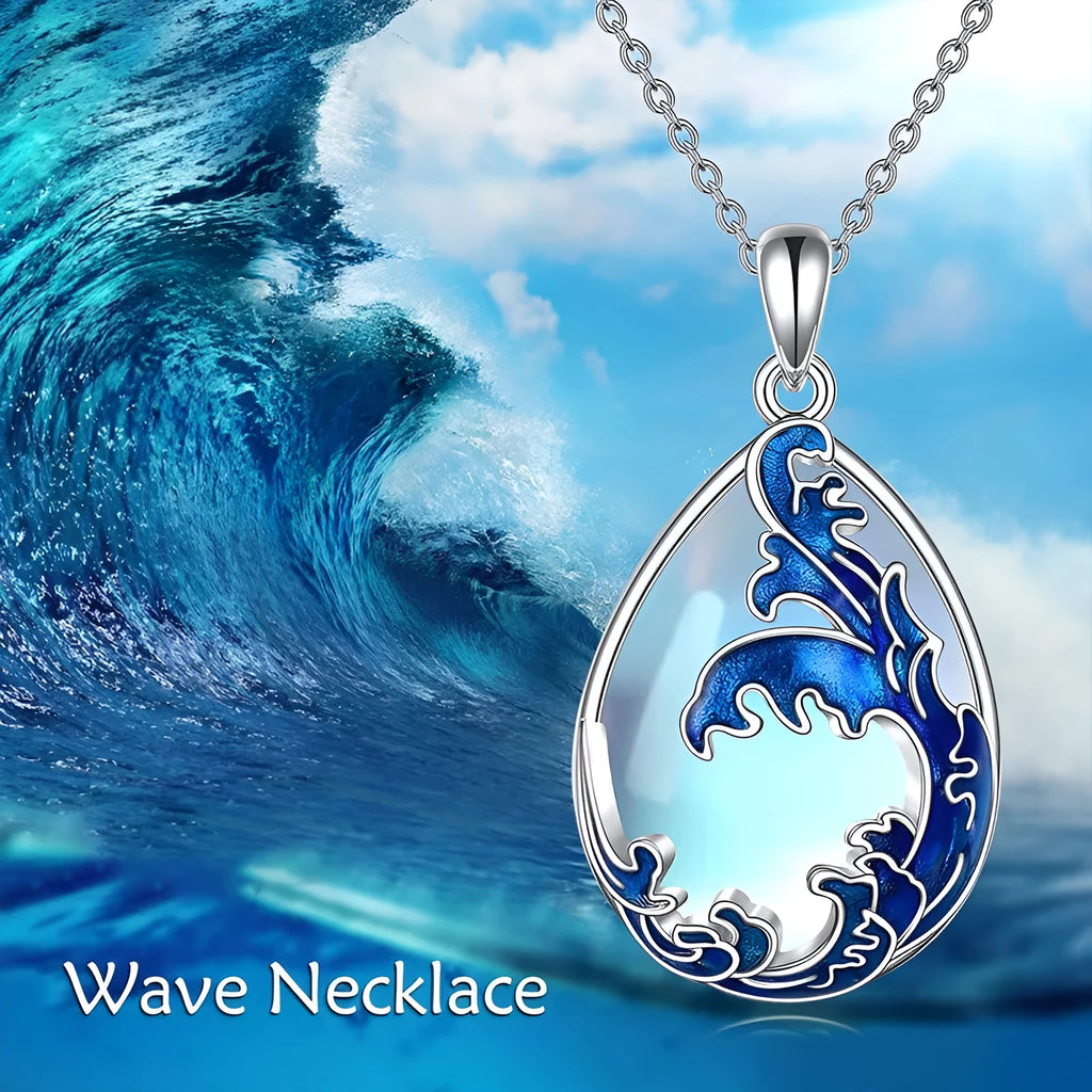 Close-up of a moonstone blue heart-shaped alloy pendant on a women's necklace.