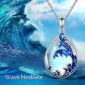Close-up of a moonstone blue heart-shaped alloy pendant on a women's necklace.