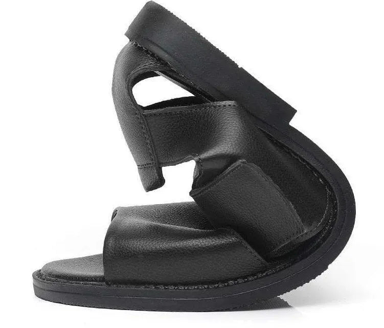 Men's black and brown leather open-toe Roman sandals with a rubber sole on a plain background.