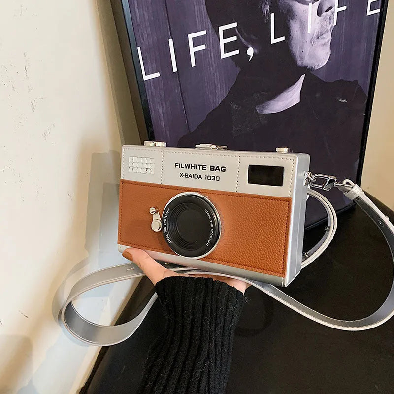 Soft PU mini crossbody camera bag in a horizontal square shape with a single strap.