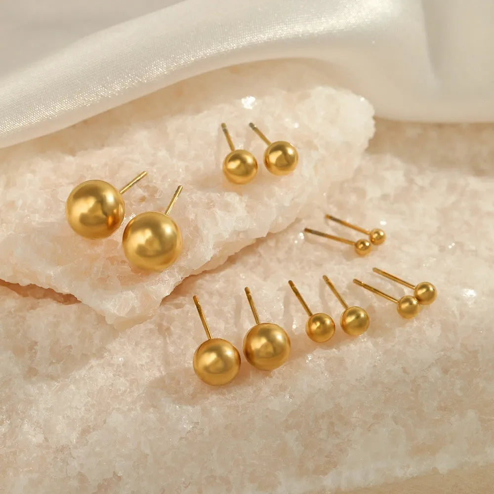 Simple stainless steel stud earrings geometric sphere design available in gold and steel colours multiple sizes