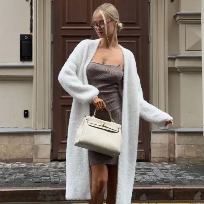 White women's sweater cardigan jacket with extended length and loose fit