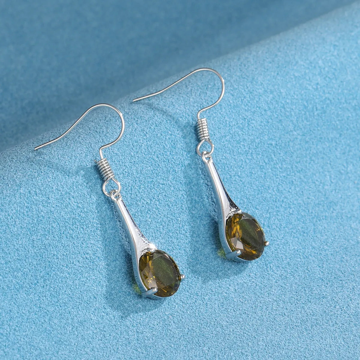 Olive green drop shape alloy earrings with electroplated finish and retro minimalist styling