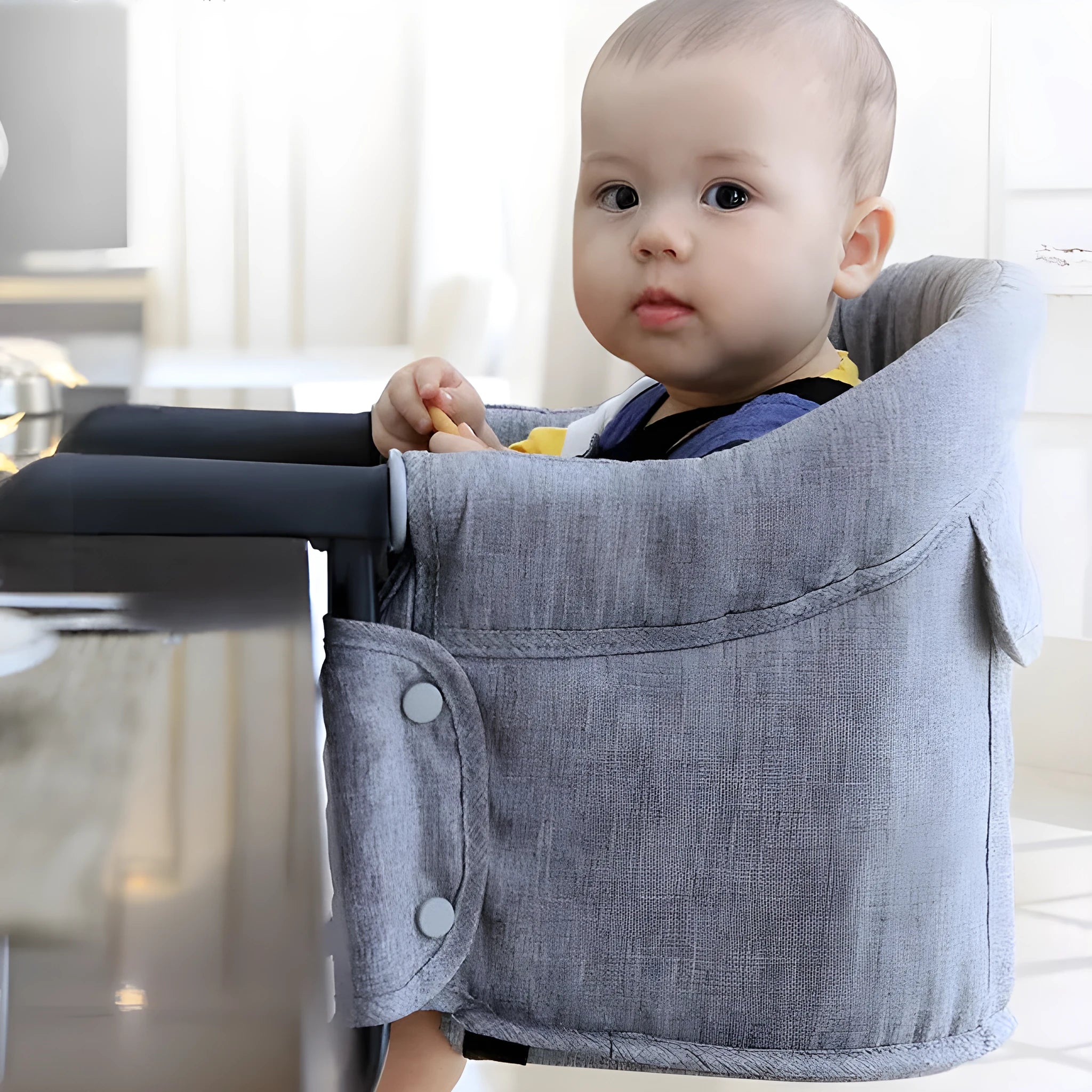 Portable baby dining seat cover with safety belt folded to show compact 42x36x7cm size
