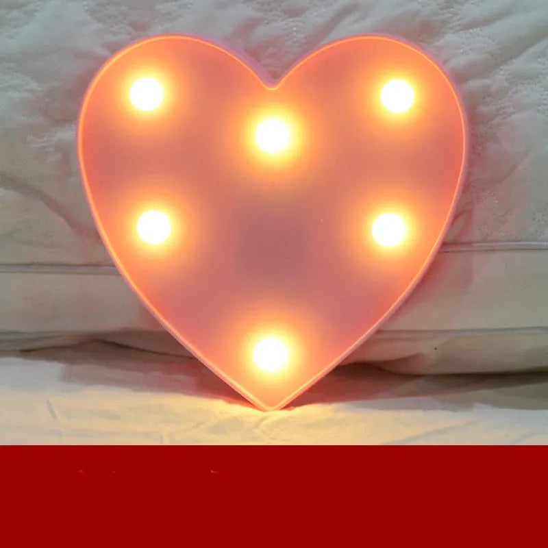 Plastic LED letter light decoration spelling a message, 22cm in height.