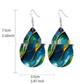 A pair of printed acrylic drop earrings with a flat branch knot design.
